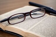 a-pair-of-glasses-on-an-open-o-2
